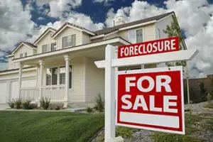 Foreclosure Sign in Front of House